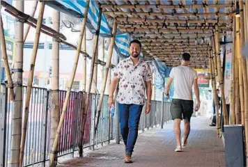  ?? Natalie B. Compton ?? CHEF Esdras Ochoa walks through Hong Kong’s Kennedy Town, where he’s opening a restaurant in August.