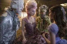  ?? PHOTO BY LAURIE SPARHAM — DISNEY VIA AP ?? This image released by Disney shows, from left, Richard E. Grant, Keira Knightley, Eugenio Derbez and Mackenzie Foy in a scene from “The Nutcracker and the Four Realms.”