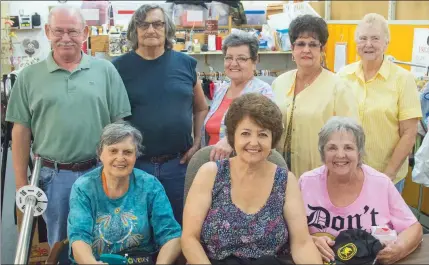  ?? PHOTOS BY WILLIAM HARVEY/THREE RIVERS EDITION ?? Sitting, from left, Marilyn Poe, Barbara Green and Linda Wilson; and standing, Bobby Hargis, Ted Garcia, Willie Ware, Sherrie Logan and Sharon Pattison, all volunteers, are shown in the Cleburne County Cares retail store in Heber Springs. Hargis said...