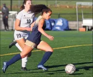  ?? Christian Abraham / Hearst Connecticu­t Media ?? Joel Barlow’s Lisi Chapin (10), left, chases Notre Dame of Fairfield’s Toni Domingos (11) as she drives the ball towards the goal during their girls soccer game in Trumbull on Thursday. Domingos was held scoreless, no easy task.