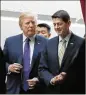  ?? JACQUELYN MARTIN / AP ?? President Donald Trump walks withHouse Speaker Paul Ryan on Thursday. House Republican­s approved their tax bill over Democratic opposition.