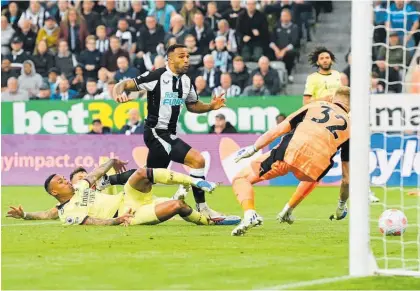  ?? Photo / Getty Images ?? Newcastle opened the scoring against Arsenal with an own goal yesterday.