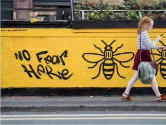  ??  ?? Bees, emblems of Manchester, feature in responses such as this mural in Stevenson Square (Getty)