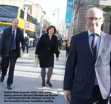  ??  ?? Central Bank Governor Philip Lane, acting deputy governor Bernard Sheridan and director of enforcemen­t Derville Rowland arriving for the Oireachtas Finance Committee meeting