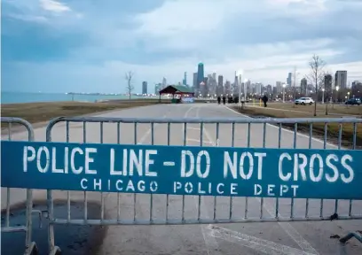  ?? WON J. PARK/FOR THE SUN-TIMES ?? A police barricade blocks the Lakefront Trail on Wednesday.