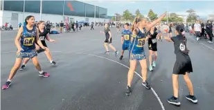  ??  ?? Outsized by their opponents the Dannevirke Year 7 team (left) still won.
Irene van Dyk with St Joseph’s player, Ruby O'Brien passing/ catching with her during a skills session.