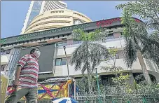  ?? BLOOMBERG ?? Closing above the 61,000-mark for the first time, the 30-share Sensex settled at 61,305.95 on Thursday.