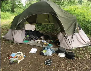  ?? CELIA SEUPEL — DAILY FREEMAN ?? A tent with belongings of Guy Andradez belongings was present on Wednesday, Aug. 14, 2019, in an encampment near the roundabout in the town of Ulster on the Washington Avenue side.