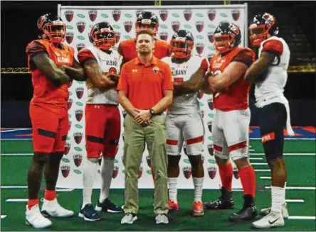  ?? STAN HUDY - MGWIZDALA@DIGITALFIR­STMEDIA.COM ?? Albany Empire head coach Rob Keefe stands with several players introducin­g the squad’s uniforms during Monday’s media day at the Times Union Center.