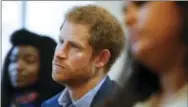  ?? ALASTAIR GRANT — THE ASSOCIATED PRESS FILE ?? This is a Monday file photo of Britain’s Prince Harry listens to a seminar for members of staff during a visit to the Mix in London. Mix is a charity that offers support to young people under the age of 25.