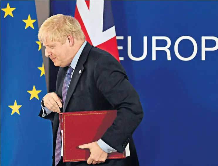  ??  ?? Boris Johnson leaves a news conference at the EU summit in Brussels yesterday