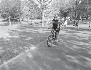  ?? Joseph B. Nadeau/The Call ?? City police patrol Autumnfest grounds via bicycle, part of increased patrols in the area.