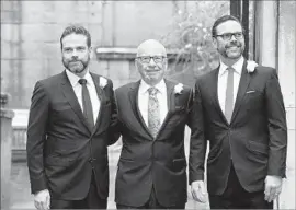  ?? Leon Neal AFP/Getty Images ?? RUPERT MURDOCH, flanked by sons Lachlan, left, and James in 2016. The sons made the case for 21st Century Fox’s takeover of Sky before the British watchdog.