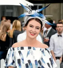  ??  ?? Claudia Campbell, of Cambridge, won the race meeting’s contempora­ry fashion section with this seagull-inspired outfit.