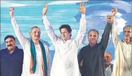  ?? AFP FILE ?? Imran Khan (centre) waves to supporters during a meeting in September as part of efforts by the opposition parties to press the government to launch a probe into the Panama Papers leaks.