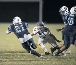  ?? PHOTO BY ROB WORMAN ?? La Plata High School senior running back Peytyn Gray looks for an opening against McDonough on Thursday. Gray and the Warriors raced to a 20-0 halftime lead en route to a 32-6 victory.