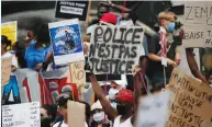  ?? (Benoit Tessier/Reuters) ?? DEMONSTRAT­ORS ATTEND a protest against police brutality at the Place de la Republique in Paris yesterday.