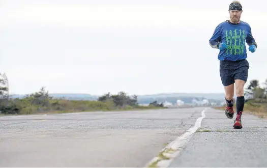  ?? JASON MALLOY/THE GUARDIAN ?? Isaac Mazer has been training for weeks for the P.E.I. Marathon and will run the course on Sunday despite the annual event being cancelled this year due to the coronaviru­s (COVID-19 strain) pandemic.