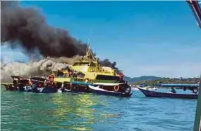  ?? BERNAMA PIC ?? The ‘Dragon One’ ferry on fire near the Langkawi Ferry Terminal on Monday.