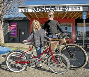  ?? PHOTOS: LUZ ZUNIGA/STUFF ?? Sam Maitland and daughter Cass show off their restored Czechoslov­ak children’s bicycle and a custom-built bamboo-framed bike, which will be part of the inaugural Show and Shine event.