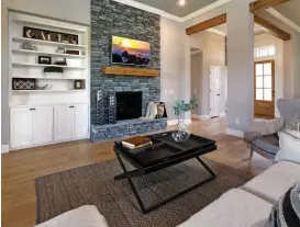  ?? [PHOTO BY STEVE SISNEY, THE OKLAHOMAN] ?? This is the living room of the “voice-controlled” concept home at 741 Villaverde Drive, built by Landmark Fine Homes.