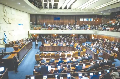  ?? (Yonatan Sindel/Flash90) ?? THE KNESSET plenum meets on the formation of the new government, last month. Israel’s parliament is functionin­g on par with its counterpar­ts in other developed countries, says the writer.