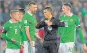  ?? REUTERS ?? ▪ Northern Ireland’s Steven Davis (L) protests penalty.