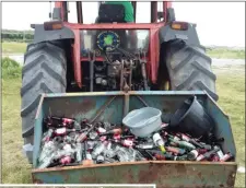  ??  ?? Beer bottles, nappies full of excrement and plastics – that is the noxious mess Maharees locals were forced to clean up as beachgoers spoiled the precious habitat near Trench Bridge during the week’s fine weather.