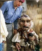  ??  ?? Standing over Hoggle is Jim Henson’s son Brian, who remote-controlled the dwarf’s face movements.