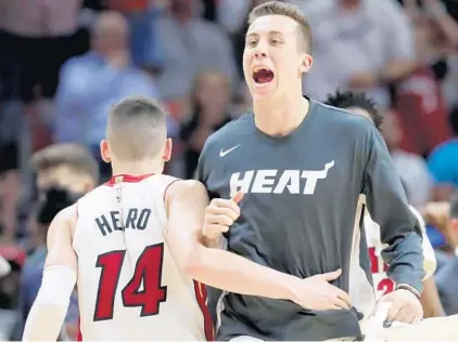  ?? LYNNE SLADKY/AP ?? The Heat’s Tyler Herro and Duncan Robinson have been charged with the challenge of Pat Riley’s expectatio­ns.