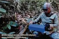  ??  ?? WANG hadiah bernilai RM10,000 ditanam dalam hutan di Lembah Klang.