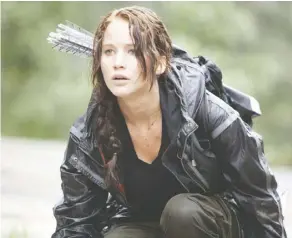  ??  ?? Jennifer Lawrence as Katniss Everdeen in The Hunger Games. Does this feisty survivalis­t qualify as a “tomboy”? Lionsgate