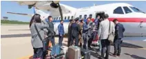  ?? - News1/Pool via Reuters ?? INVITATION: South Korean journalist­s, who will visit the nuclear testing site at Punggye-ri, arrive at Kalma airport in Wonsan, North Korea, on May 23, 2018.