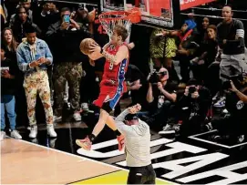  ?? Patrick T. Fallon/AFP/TNS ?? Mac McClung of the Philadelph­ia 76ers competes in the Slam Dunk Contest during NBA All-Star Weekend Saturday in Salt Lake City.