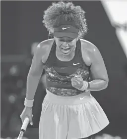  ?? MARK DADSWELL/AP ?? Naomi Osaka reacts Saturday after winning a point against Jennifer Brady in the women’s singles final at the Australian Open.