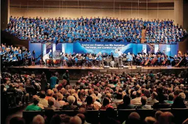  ?? [PHOTOS BY SARAH PHIPPS, THE OKLAHOMAN] ?? People listen to a choir Sunday during the Homecoming Service for 100 years of Falls Creek in Davis. To see more photos from the event, go online to Oklahoman.com.