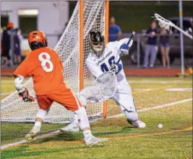  ?? M JOHN MCCONNEY - FOR DIGITAL FIRST MEDIA ?? Spring-Ford goalie Kyle Pettine (46) stops a shot from Perkiomen Valley’s Connor Roop during Monday’s game.