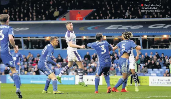  ??  ?? Daryl Murphy is surrounded by Birmingham players