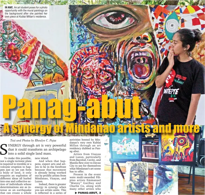  ??  ?? IN AWE. An art student poses for a photo opportunit­y with the mural paintings on the background after she painted her own piece at Kublai Millan’s residence.