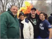  ?? EVAN BRANDT — DIGITAL FIRST MEDIA ?? Pottstown Borough Council members, from left, Joe Kirkland, Don Lebedynsky, Carol Kulp and Mayor Stephanie Henrick warm up at the bonfire Pottstown’s 11th Annual Polar Bear Plunge in Riverfront Park. All but Kulp took the plunge into the Schuylkill River this year.