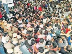  ?? PTI ?? Supporters of DMK wait outside the Kauvery Hospital in Chennai on Sunday where party chief Karunanidh­i is undergoing treatment. Party leader A Raja said the former chief minister continues to be in the ICU.