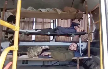  ?? RUSSIAN DEFENSE MINISTRY PRESS SERVICE VIA AP ?? Wounded Ukrainian servicemen lie in a bus as they are evacuated Tuesday from the besieged Azovstal steel plant in Mariupol, Ukraine.