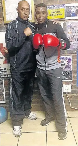  ?? / SUPPLIED ?? WBF All Africa junior flyweight boxing champion Mpho Seforo, right, and his new trainer Bernie Pailman.