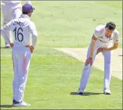  ?? AP ?? Pacer Navdeep Saini reacts after injuring his groin while bowling during Day 1 of the fourth Test in Brisbane.