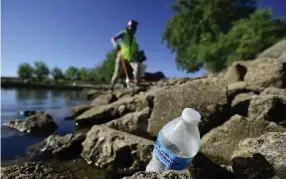  ?? Photos by Matthew Jonas, Daily Camera ?? Jane Angulo searches for trash at Boulder Reservoir on July 8. Volunteers and PLAY Boulder Foundation have been helping to keep Boulder parks clean during staffing cuts resulting from the pandemic.