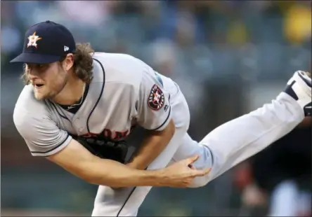  ?? BEN MARGOT — THE ASSOCIATED PRESS FILE ?? In this file photo, Houston Astros pitcher Gerrit Cole follows through on a delivery to an Oakland Athletics batter during the first inning of a baseball game in Oakland Cole, Corey Kluber and Clayton Kershaw are among the many big league pitchers maximizing success by throwing fewer fastballs.