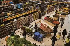  ?? Associated Press ?? People shop at a supermarke­t in Beirut, Lebanon, on March 15. Soaring energy and food prices triggered by Russia’s invasion of Ukraine are pushing some Middle Eastern countries to the brink.