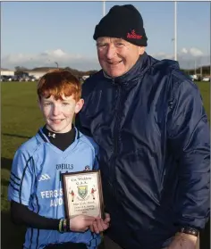  ??  ?? Matt Miley receives the Wicklow People Man of the Match award from Liam O’Loughlin.
