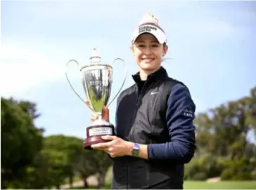  ?? AFP/VNA Photo ?? AT HER BEST: Nelly Korda of the US celebrates with the trophy after winning the FIR HILLS SERI PAK Championsh­ip at Palos Verdes Golf Club on March 24, 2024 in Palos Verdes Estates, California.