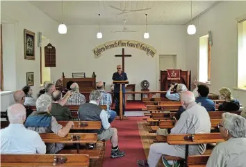  ?? Pictures: MARK CARRELS ?? CHURCH FOUNDING: Tom Penlington engages a group attending a Bathurst historical trail walk in the York Road Methodist Church on Saturday November 4 about the founding of the church in the 1830s.
